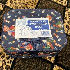 Beautiful jewelry box. Brand new with tags.Has many compartments for everything.